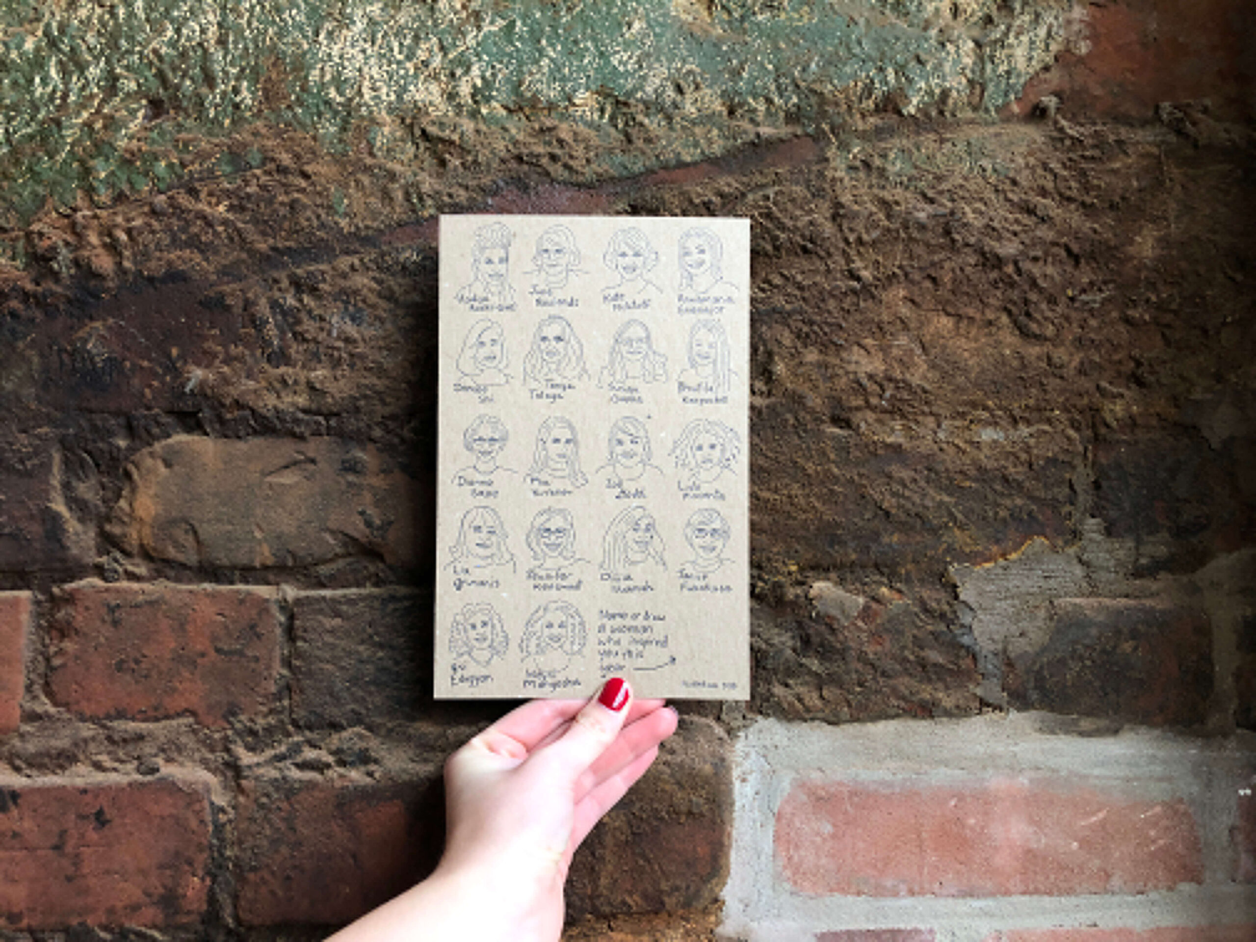 A picture of a holiday card featuring drawings of 18 amazing women