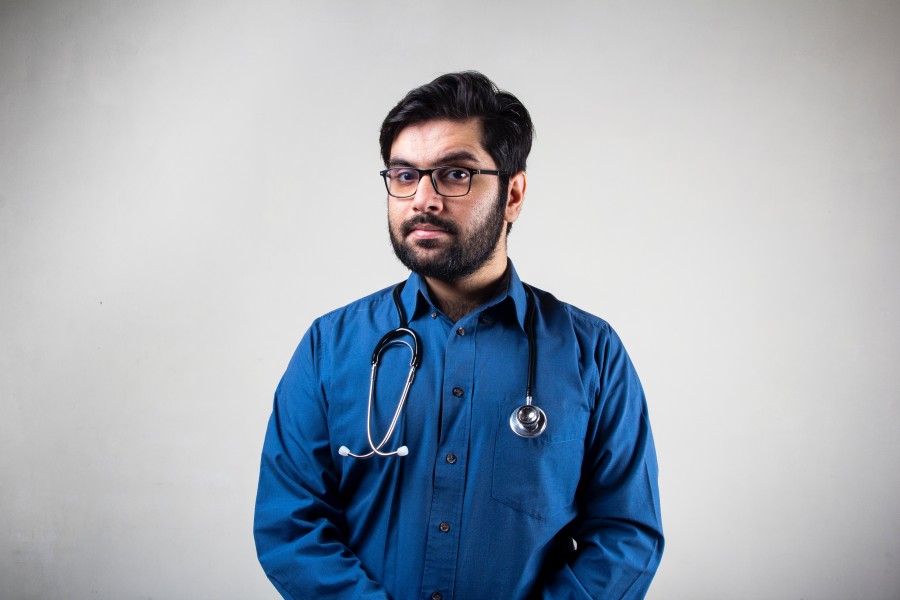 A doctor looking into the camera
