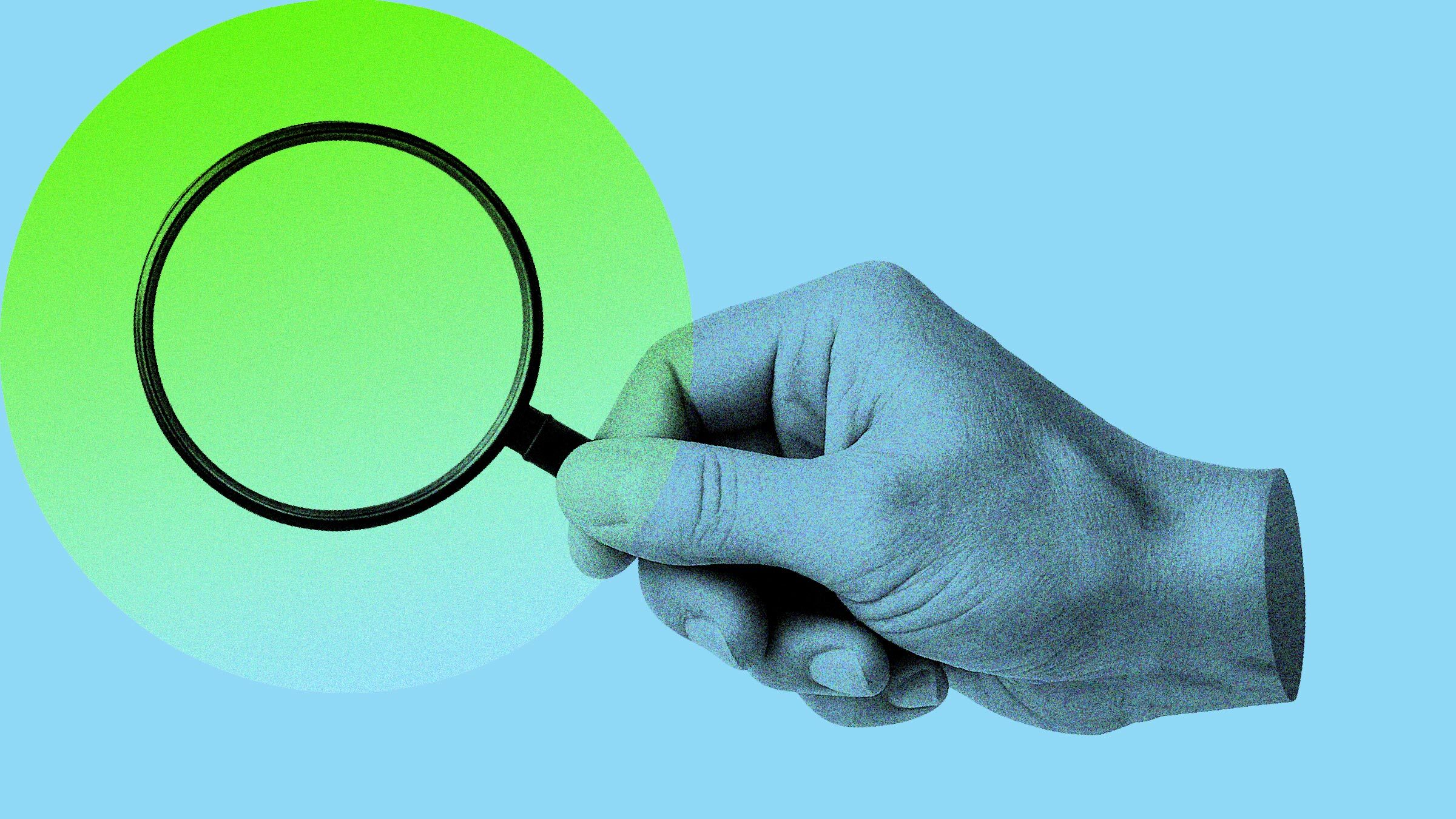 a heand holding a magnifier