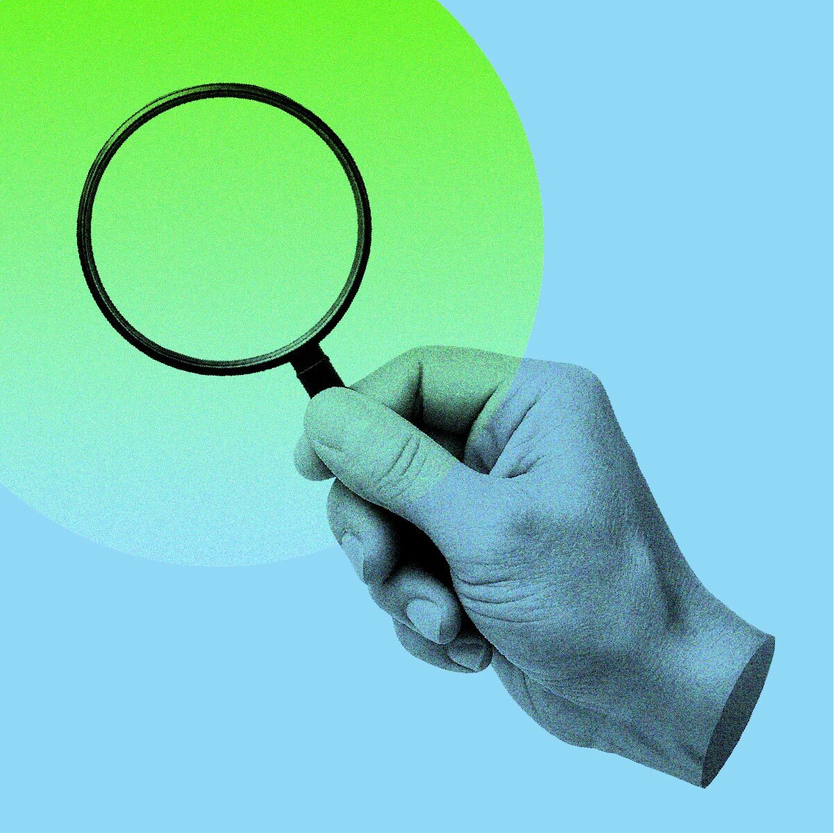 a hand holding a magnifier