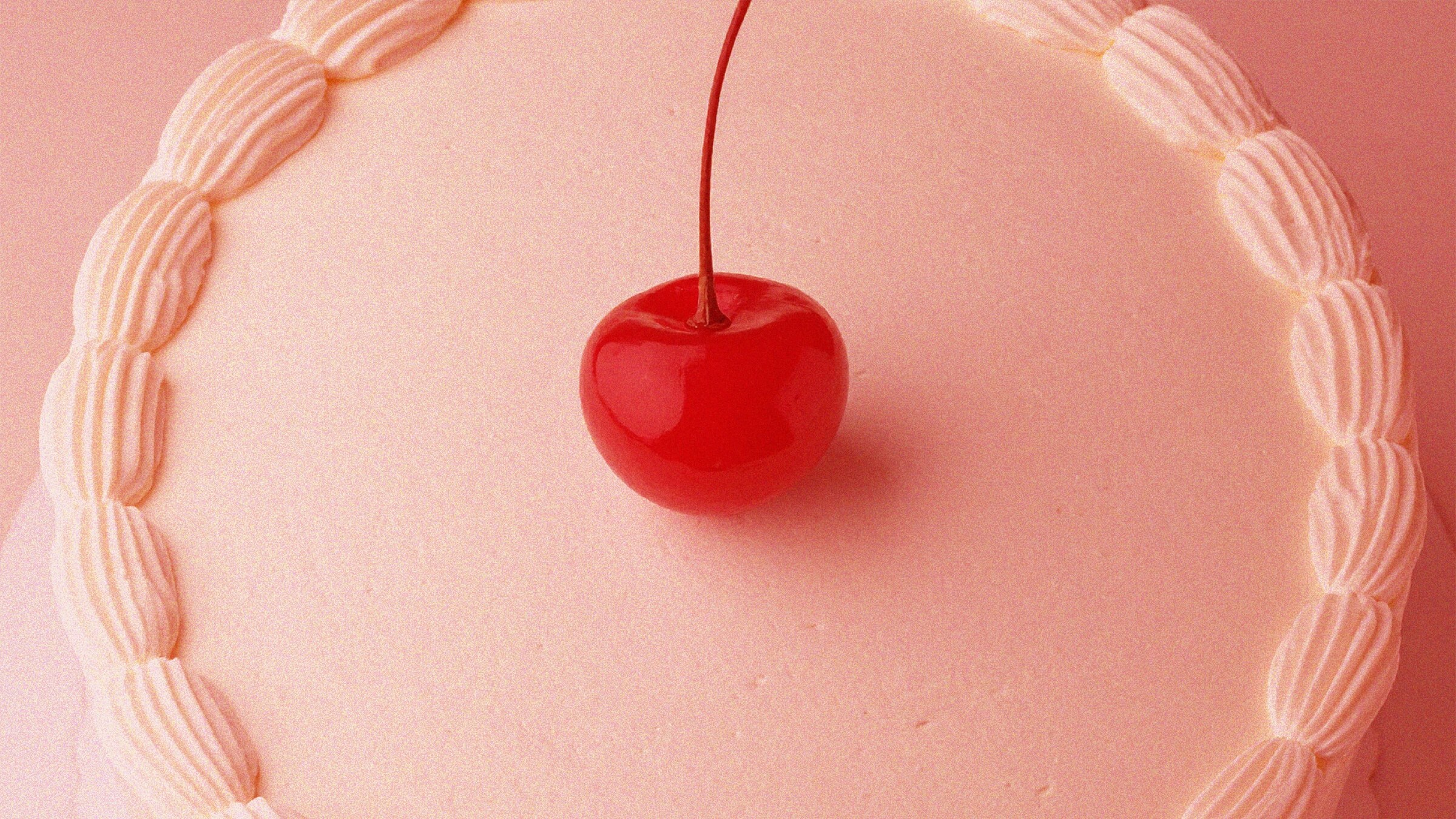 Cherry and icing on a cake
