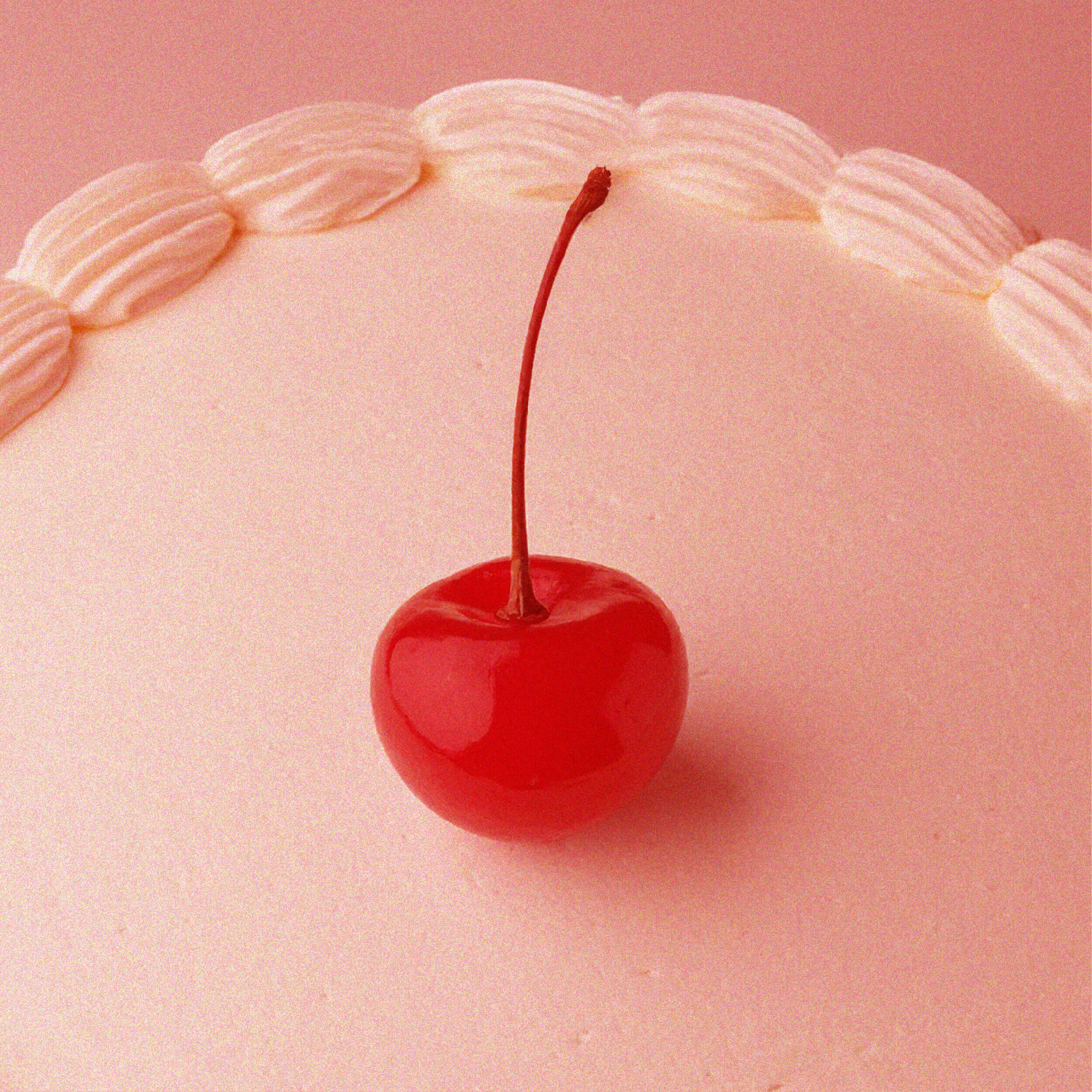 Cherry and icing on a cake
